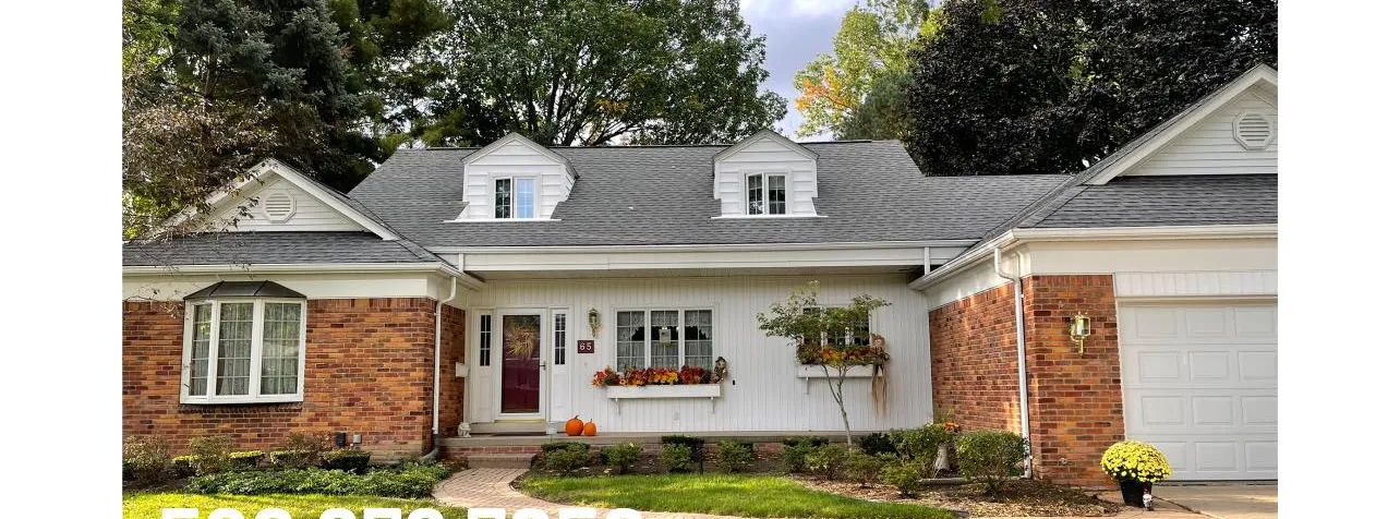 Brick and white sided Cape Cod home after a G&L exterior cleaning